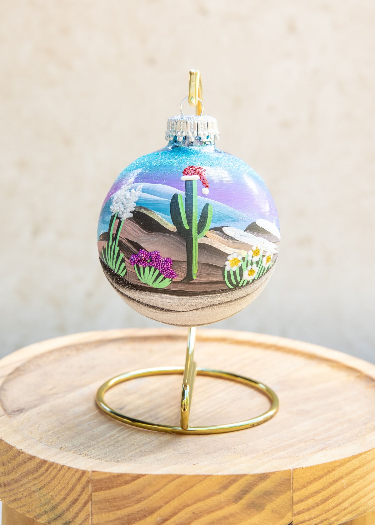 Snow Capped Mountains Hand Painted glass ornament by Brenda, Santa hat version