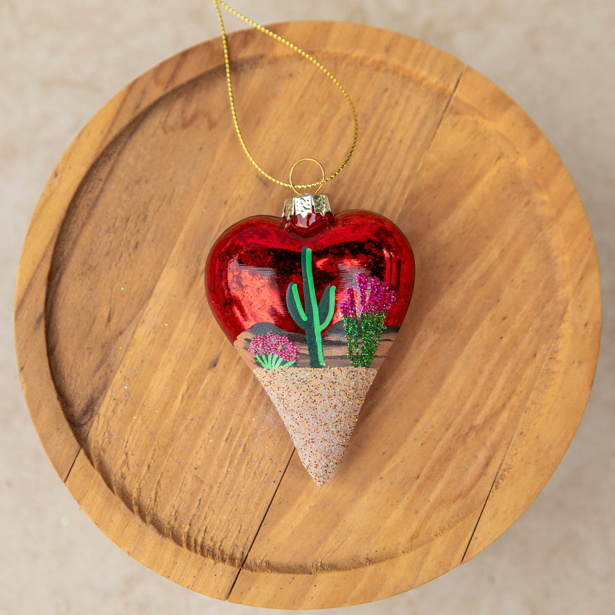 Limited Edition Desert Heart Hand Painted glass ornament by Brenda, a desert scene on a red sparkle heart