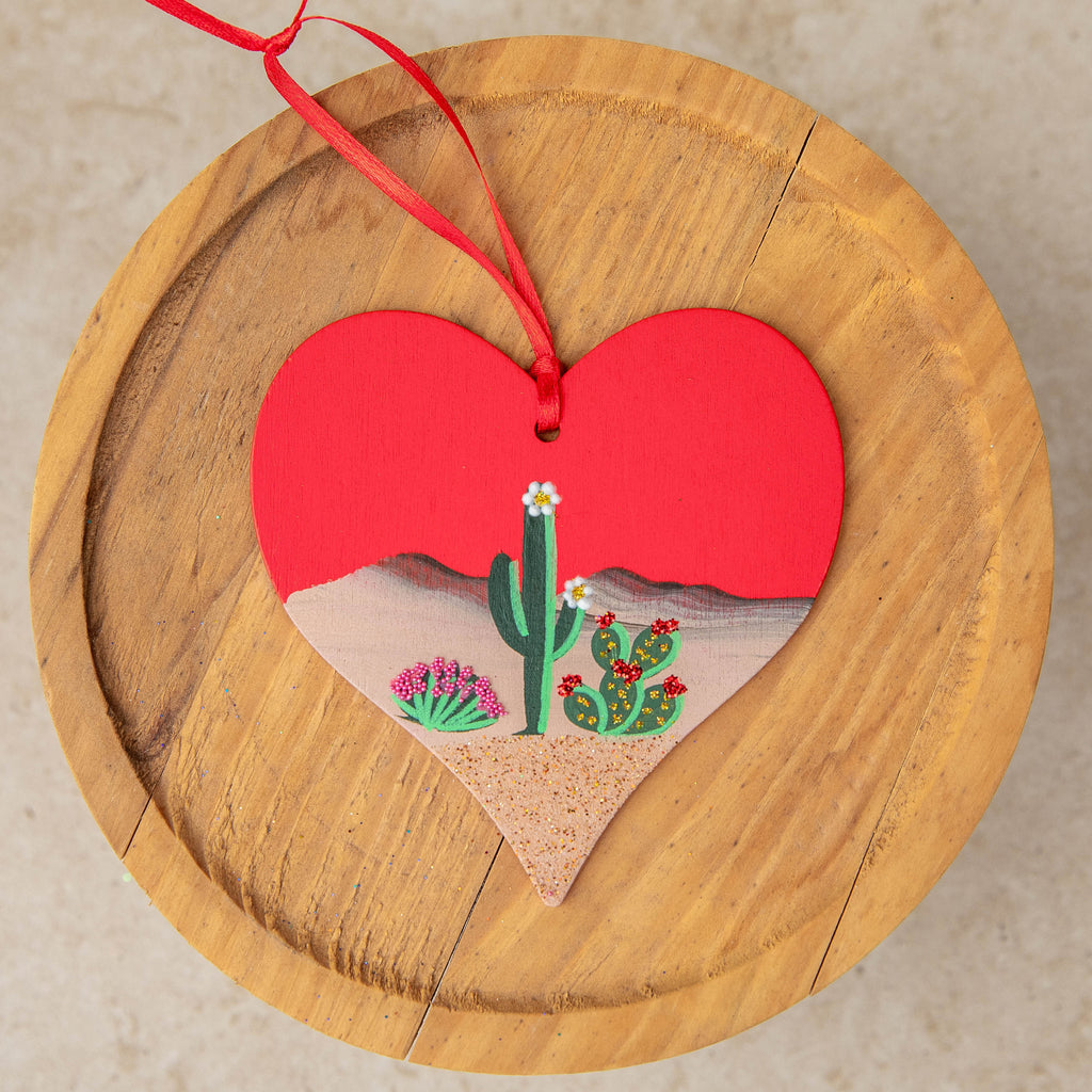 Limited Edition Wooden Red Heart ornament with a simple desert scene hand painted by Brenda