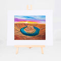Horseshoe Bend, Brenda's painting of the Colorado River curving around Horseshoe Bend's sandstone cliffs at sunset, shown as a matted 8x10 art print