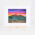 Camelback Mountain, Brenda's painting of Camelback Mountain with saguaros, palms, and desert plants at sunset, shown as a matted 8x10 art print