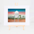 Gilbert Water Tower, Brenda's painting of Gilbert's historic water tower among saguaros and palms at sunset, shown as a matted 8x10 art print